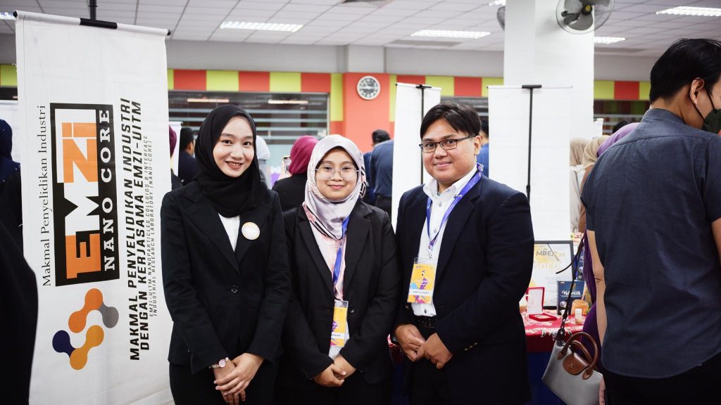 i-SIIDEC 2024: Three team members beside the NANO CORE banner