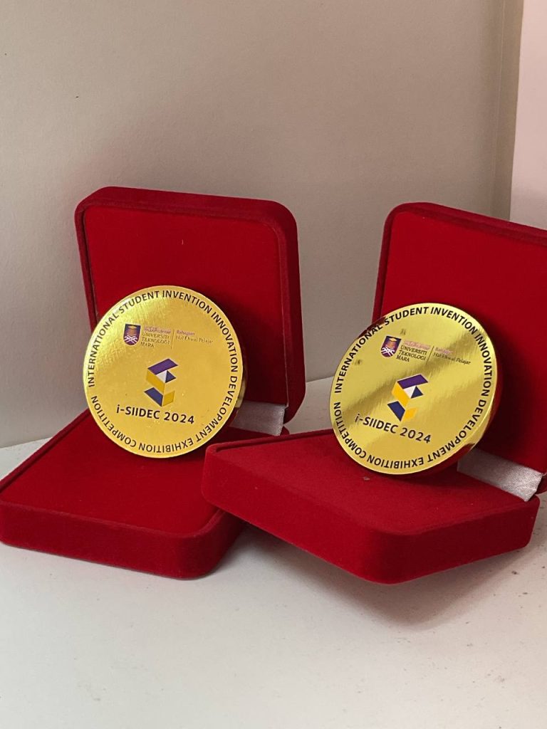 i-SIIDEC 2024: Two i-SIIDEC 2024 gold medals in red boxes